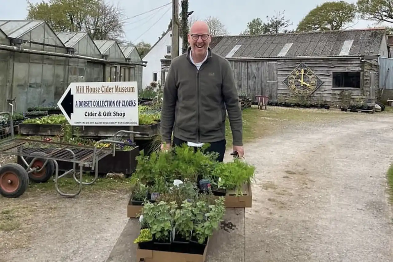 Jamie with the wheelbarrow of new herbs and plants Jamie with the wheelbarrow of new herbs and plants
